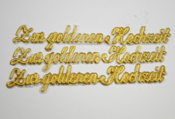 Schriftzug Zur goldenen Hochzeit aus Wachs in gold